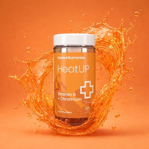 Swiss Gummies HeatUP supplement bottle with orange liquid splash on an orange background