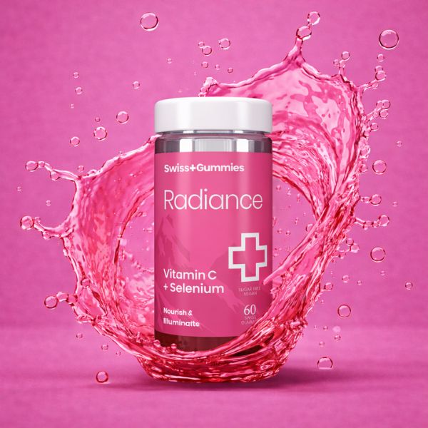 Swiss Gummies Radiance supplement bottle with pink liquid splash on a pink background