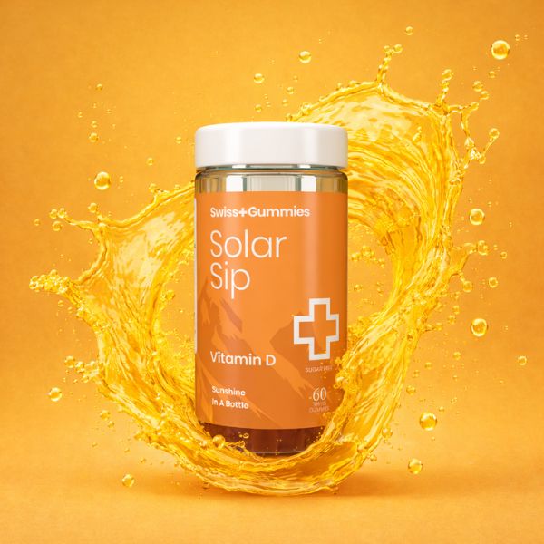 Solar Sip Vitamin D supplement bottle with an orange splash on a yellow background